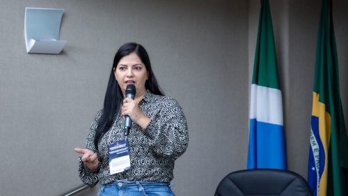 a woman speaking into a microphone